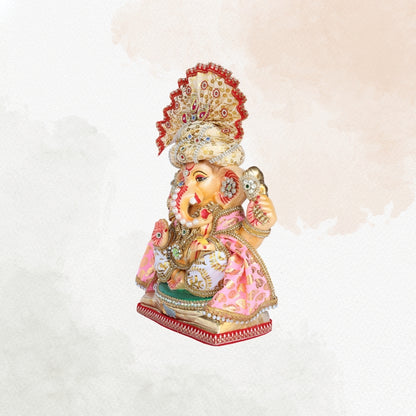 13 Inch – Elegant Cream & Gold Shadu Mitti Ganesha Idol with Royal Pagdi, Fan Crown & Floral Pearl Jewelry