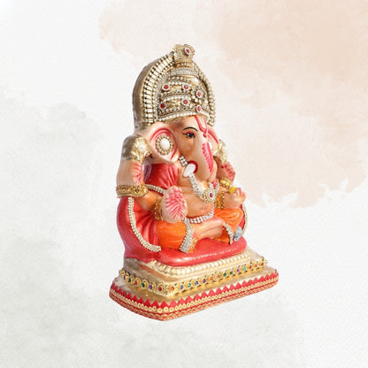 11 Inch – Royal Seated Ganesha Idol in Orange Attire | Shadu Mitti Clay Murti with Beaded Crown & Pearl Stone Work