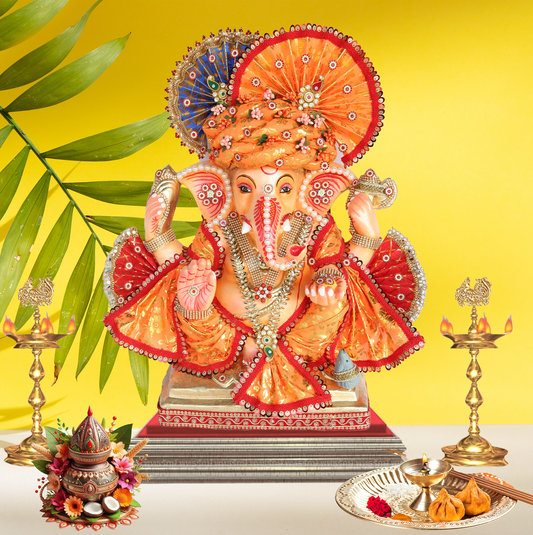19 Inch – Traditional Orange Attired Ganesha Idol – Shadu Mitti Clay Murti with Floral Pagdi & Designer Fan