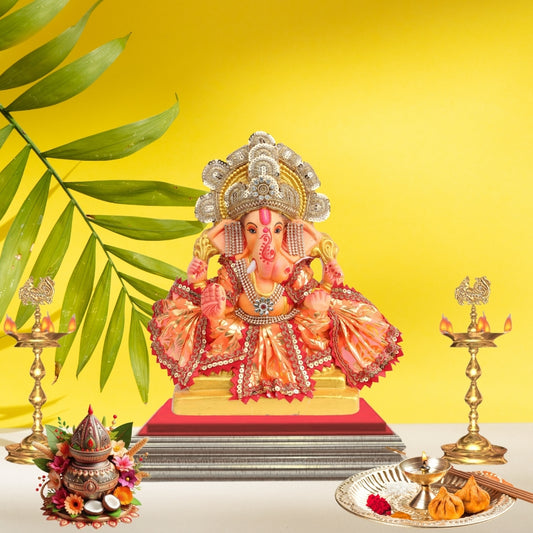 11 Inch – Vibrant Seated Ganesha Idol in Orange & Gold Attire | Eco-Friendly Shadu Mitti Murti with Pearl Crown & Lace Work