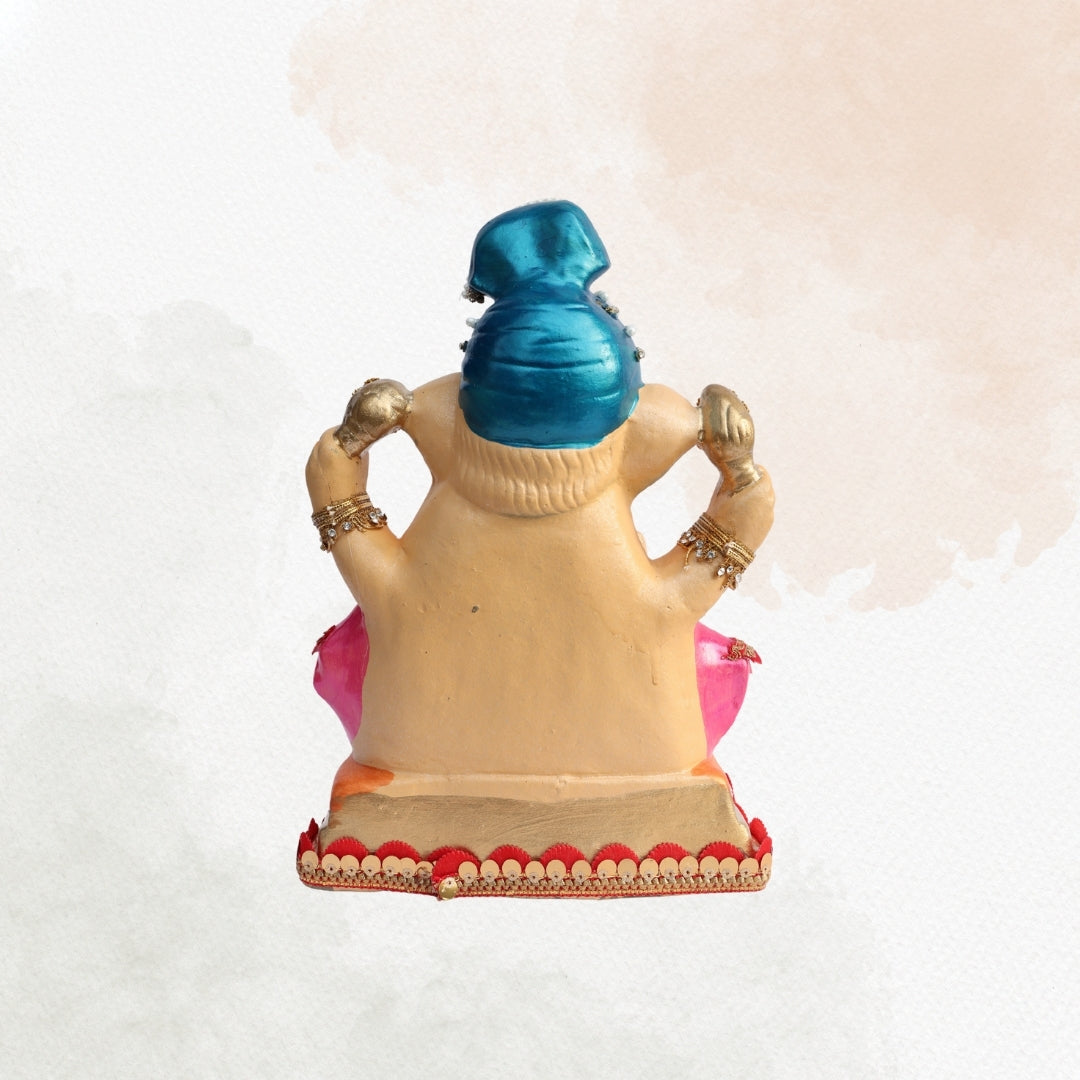 11 Inch – Elegant Seated Ganesha Idol in Blue Dhoti & Pink Shawl | Shadu Mitti Eco-Friendly Murti with Pearl-Adorned Crown & Rich Decorative Finish