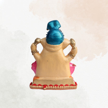 11 Inch – Elegant Seated Ganesha Idol in Blue Dhoti & Pink Shawl | Shadu Mitti Eco-Friendly Murti with Pearl-Adorned Crown & Rich Decorative Finish