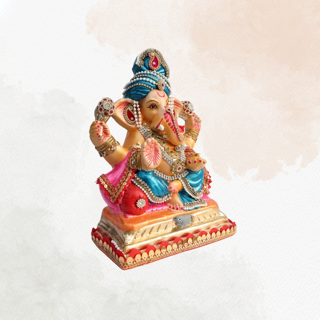 11 Inch – Elegant Seated Ganesha Idol in Blue Dhoti & Pink Shawl | Shadu Mitti Eco-Friendly Murti with Pearl-Adorned Crown & Rich Decorative Finish