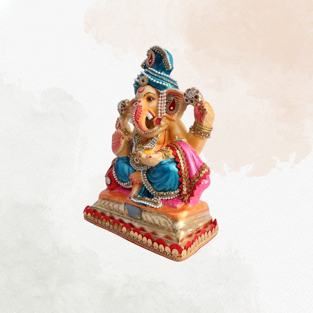 11 Inch – Elegant Seated Ganesha Idol in Blue Dhoti & Pink Shawl | Shadu Mitti Eco-Friendly Murti with Pearl-Adorned Crown & Rich Decorative Finish