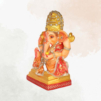 23 Inch – Traditional Seated Ganesha Idol in Red & Orange Floral Attire | Shadu Mitti Clay Murti with Golden Crown & Pearl Jewelry