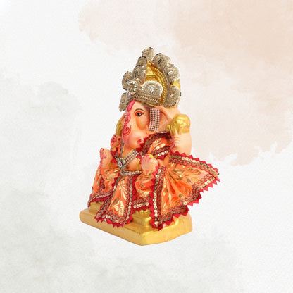 11 Inch – Vibrant Seated Ganesha Idol in Orange & Gold Attire | Eco-Friendly Shadu Mitti Murti with Pearl Crown & Lace Work