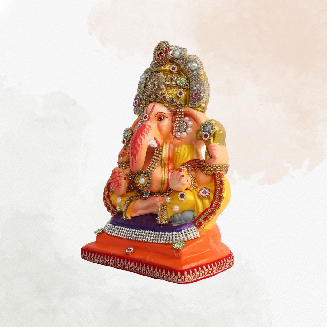 11 Inch – Divine Seated Ganesha Idol in Yellow Attire | Shadu Mitti Clay Murti with Silver Crown & Multistone Work