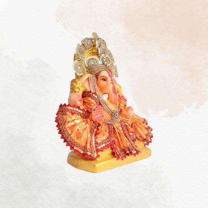 11 Inch – Vibrant Seated Ganesha Idol in Orange & Gold Attire | Eco-Friendly Shadu Mitti Murti with Pearl Crown & Lace Work