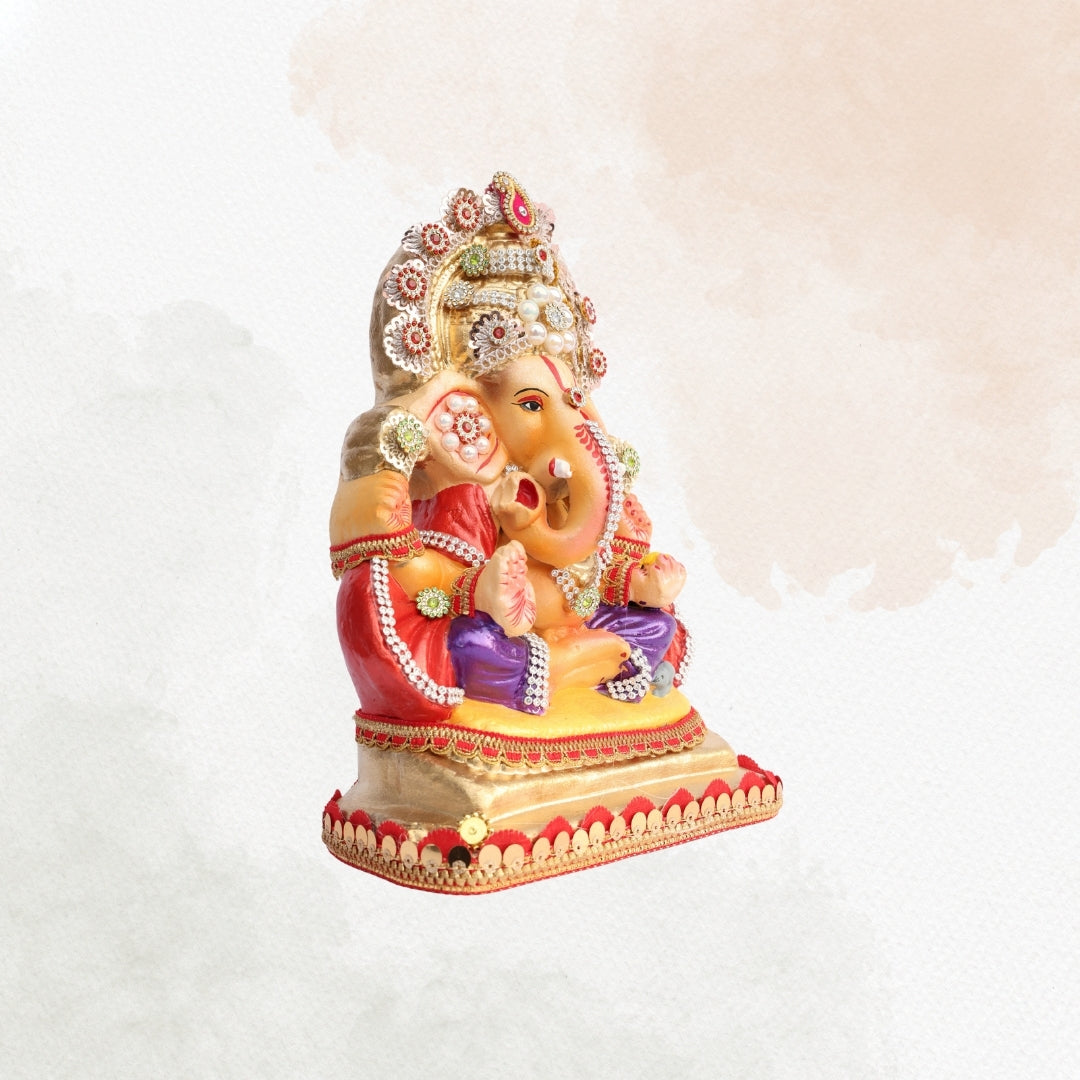 11 Inch – Ganesha Idol in Royal Purple Dhoti with Golden Crown | Shadu Mitti Clay Murti with Pearl Motif & Red Drapes
