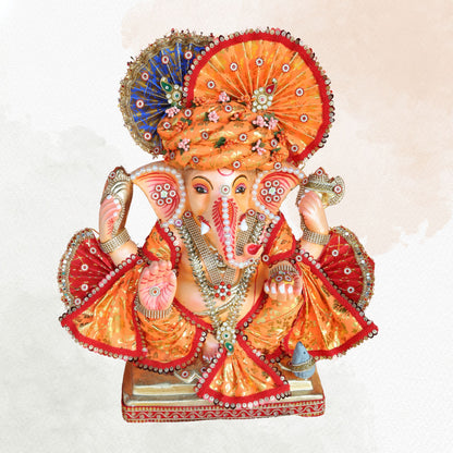 19 Inch – Traditional Orange Attired Ganesha Idol – Shadu Mitti Clay Murti with Floral Pagdi & Designer Fan