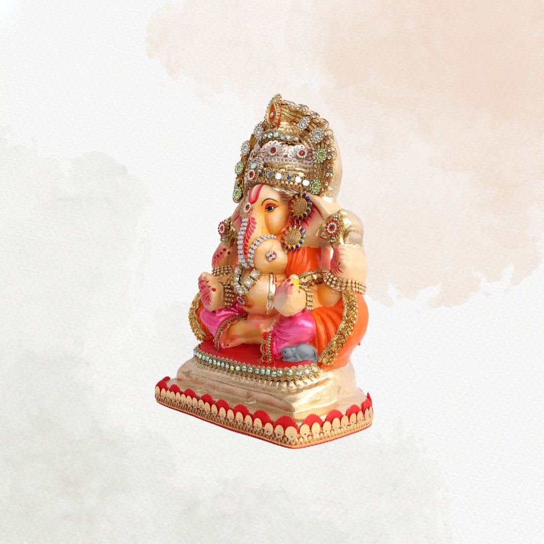11 Inch – Ganesha Idol in Pink-Orange Attire with Grand Golden Crown | Eco-Friendly Shadu Mitti Ganpati Murti with Sparkling Detailing & Classic Seated Pose