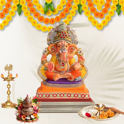 11 Inch – Ganesha Idol in Yellow-Orange Attire with Majestic Red-Green Bejeweled Crown | Eco-Friendly Shadu Mitti Ganpati Murti