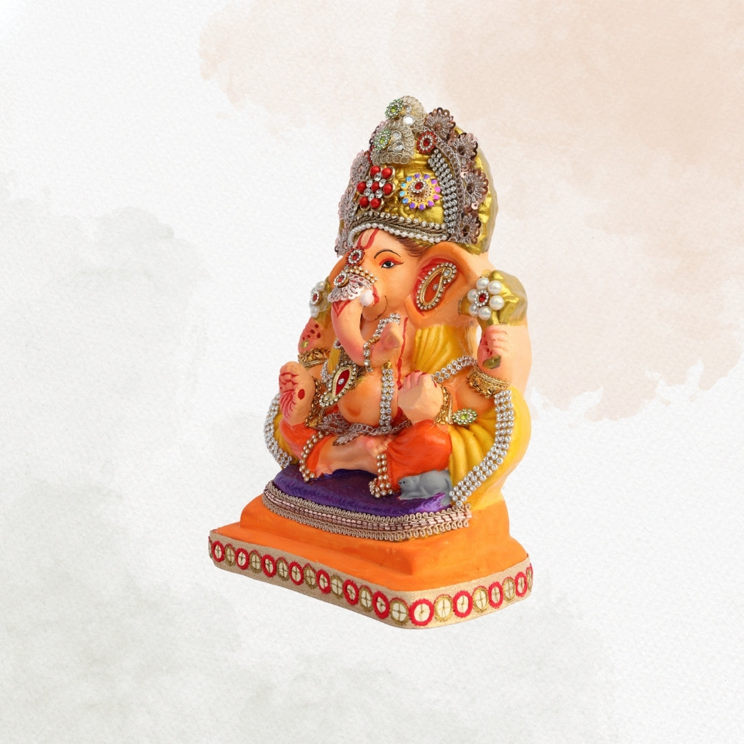 11 Inch – Ganesha Idol in Yellow-Orange Attire with Majestic Red-Green Bejeweled Crown | Eco-Friendly Shadu Mitti Ganpati Murti
