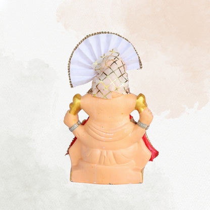 13 Inch – Majestic Seated Ganesha Idol in Red Floral Attire | Shadu Mitti Clay Murti with Cream Maharashtrian Pagdi & Stone Embellished Jewelry