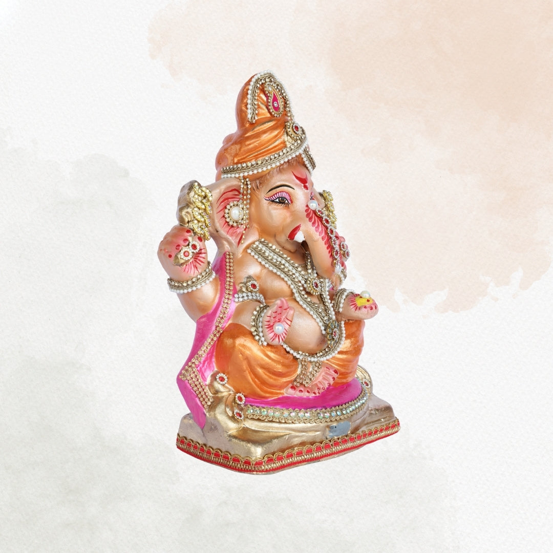 13 Inch – Regal Seated Ganesha Idol in Orange-Pink Attire Shadu Mitti Clay Murti with Gold Crown & Stone Work