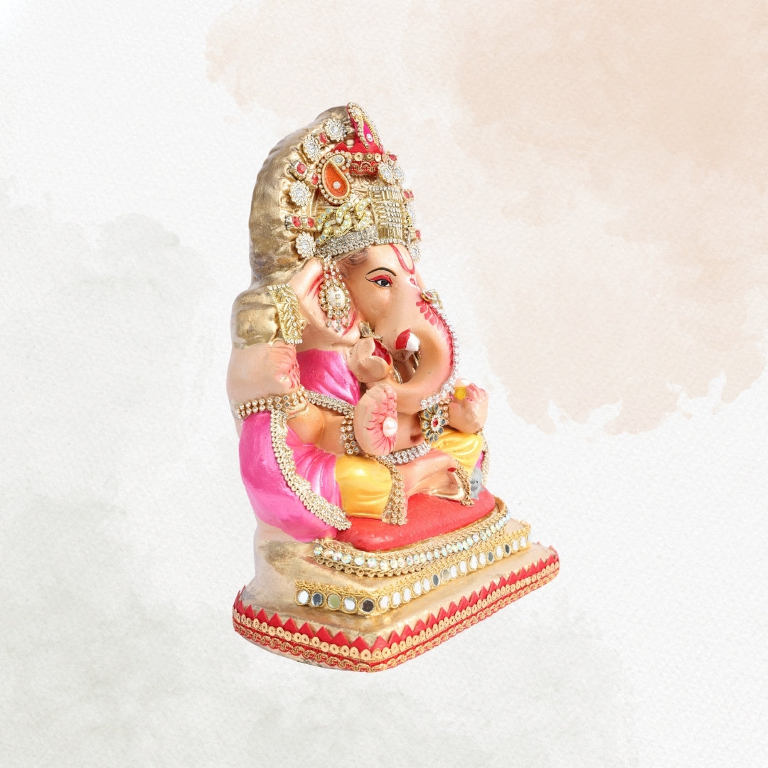 11 Inch – Elegant Seated Ganesha Idol in Pink-Yellow Attire | Shadu Mitti Eco-Friendly Murti with Heavy Golden Crown & Pearl Detailing