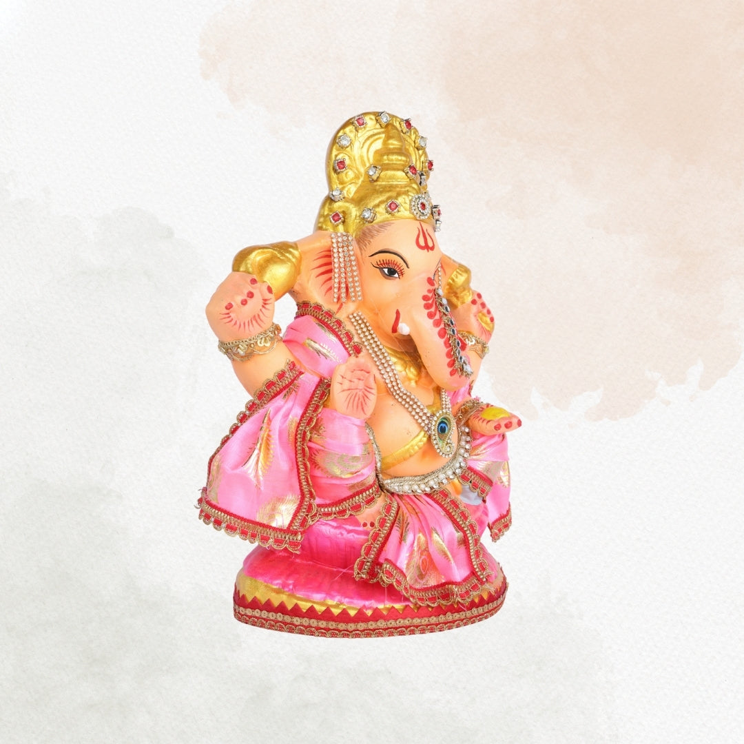 13 Inch – Divine Seated Ganesha Idol in Pink Silk Attire Shadu Mitti Clay Murti with Gold Crown & Peacock Motif Stone Work