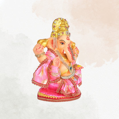 13 Inch – Divine Seated Ganesha Idol in Pink Silk Attire Shadu Mitti Clay Murti with Gold Crown & Peacock Motif Stone Work