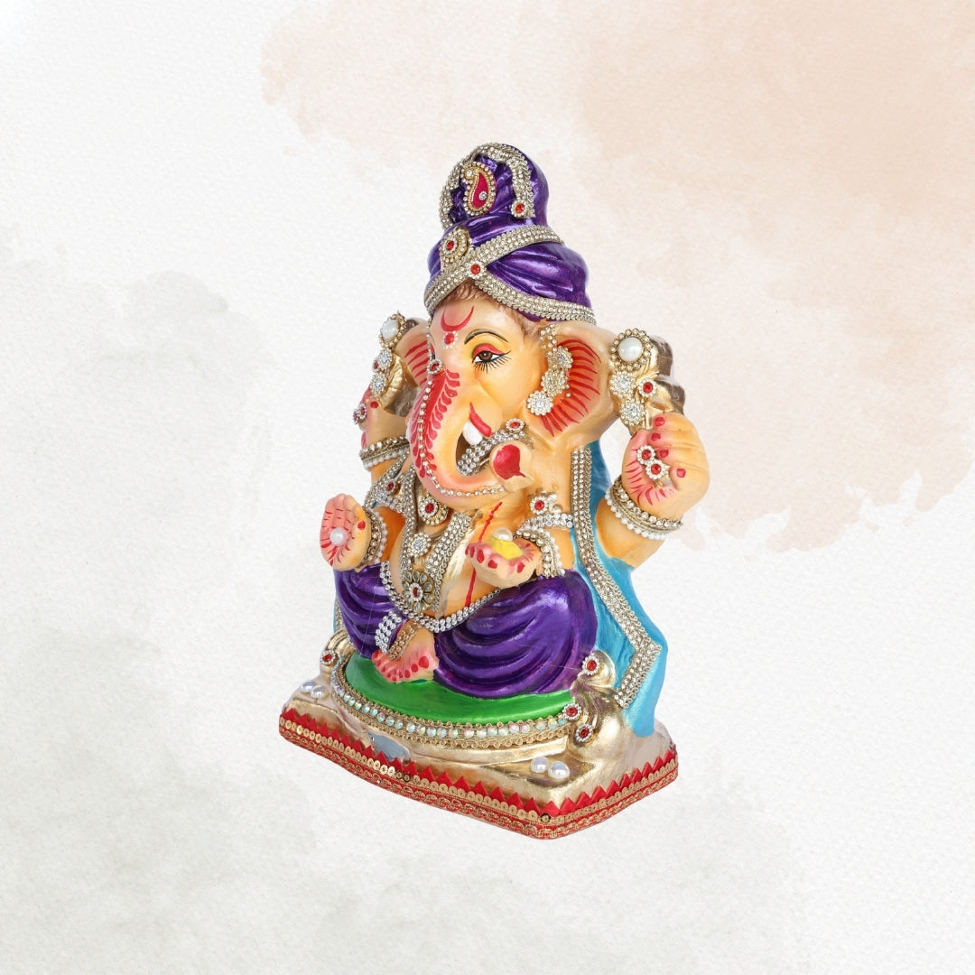 13 Inch – Royal Seated Ganesha Idol in Purple Attire Shadu Mitti Clay Murti with Blue Shawl & Pearl Stone Crown