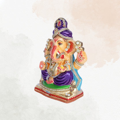 13 Inch – Royal Seated Ganesha Idol in Purple Attire Shadu Mitti Clay Murti with Blue Shawl & Pearl Stone Crown