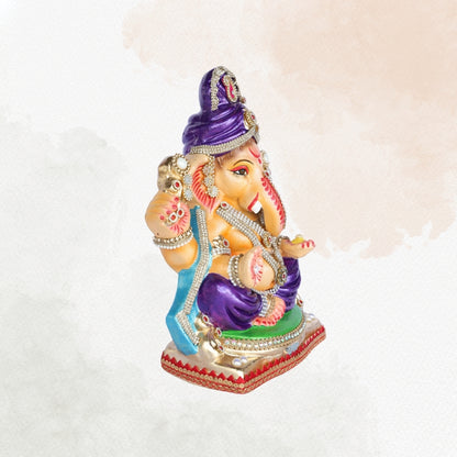 13 Inch – Royal Seated Ganesha Idol in Purple Attire Shadu Mitti Clay Murti with Blue Shawl & Pearl Stone Crown