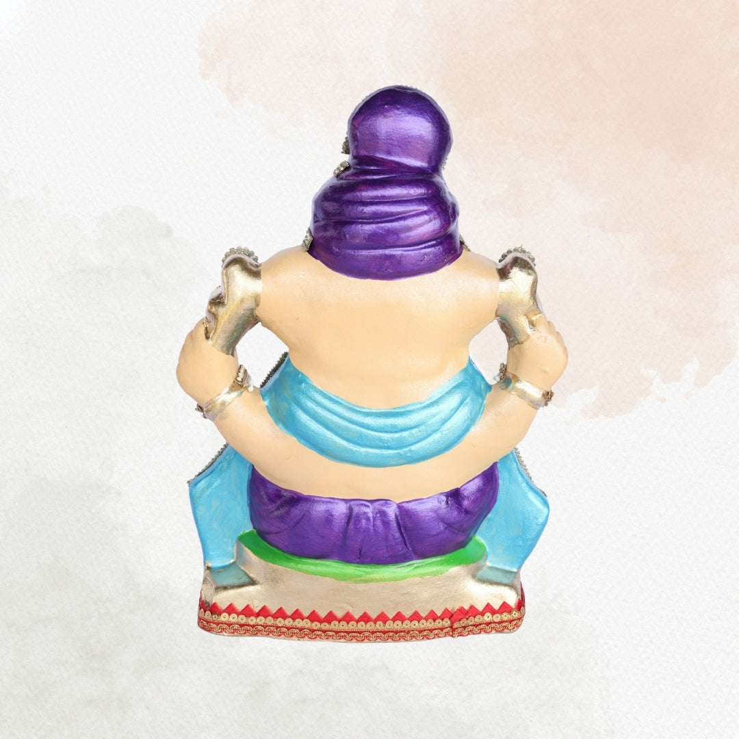 13 Inch – Royal Seated Ganesha Idol in Purple Attire Shadu Mitti Clay Murti with Blue Shawl & Pearl Stone Crown