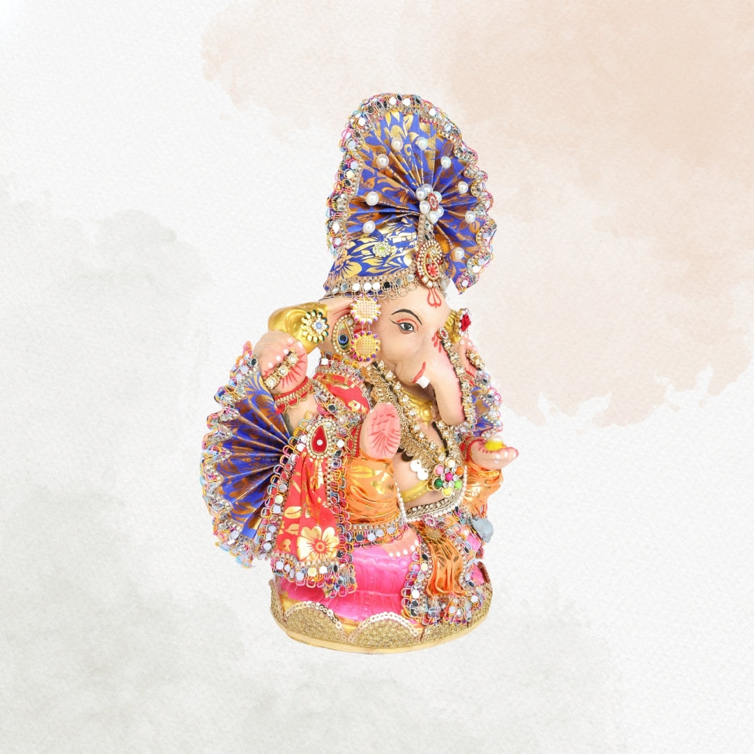 13 Inch – Ganesha Idol with Royal Blue Crown, Orange Attire & Decorative Fan-Style Pagdi