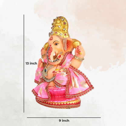 13 Inch – Divine Seated Ganesha Idol in Pink Silk Attire Shadu Mitti Clay Murti with Gold Crown & Peacock Motif Stone Work