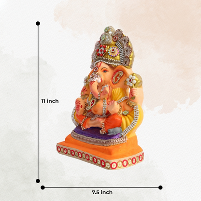11 Inch – Ganesha Idol in Yellow-Orange Attire with Majestic Red-Green Bejeweled Crown | Eco-Friendly Shadu Mitti Ganpati Murti